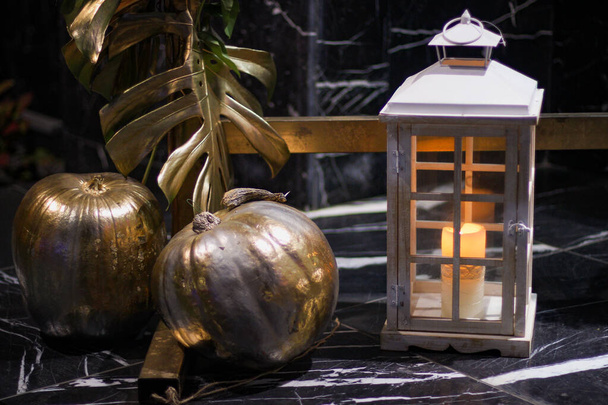 Halloween's holiday attributes in evening. Lantern and pumpkins - Photo, Image