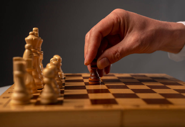 Business financial strategy concept. Businessman making solution and moving chess piece to opponent field. - Fotografie, Obrázek