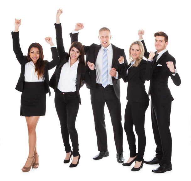 Successful Welldressed Businesspeople With Arms Raised - Foto, immagini