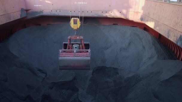 Ship unloading or discharging coal from ship to terminal in energy business - Footage, Video