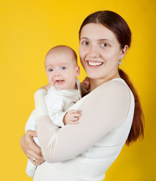 Mother holding young baby - Photo, Image
