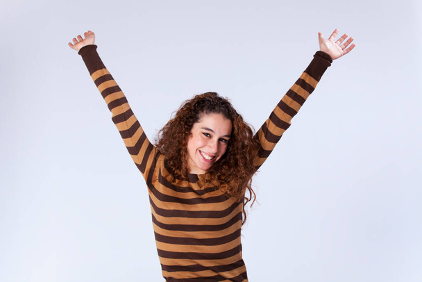 Beautiful young woman with outstretched arms - Fotoğraf, Görsel