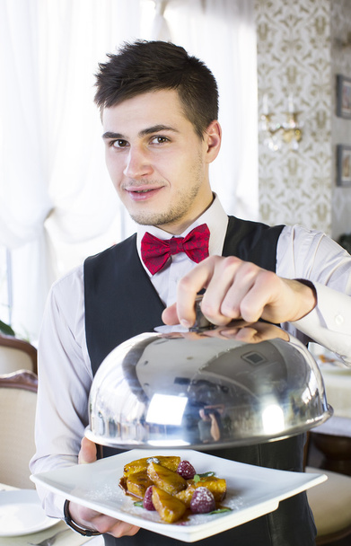 Waiter with a tray of food - Fotó, kép