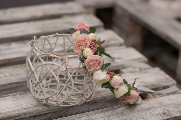 Wedding wreath of roses and eucalyphus on white wood table. - Photo, Image