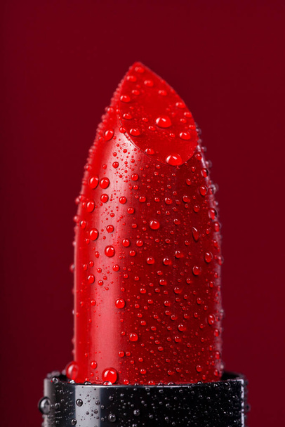 Red lipstick on a red background - Photo, Image