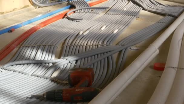 CLOSE UP: Electricity tubing is laid across the first floor of a housing project - Footage, Video