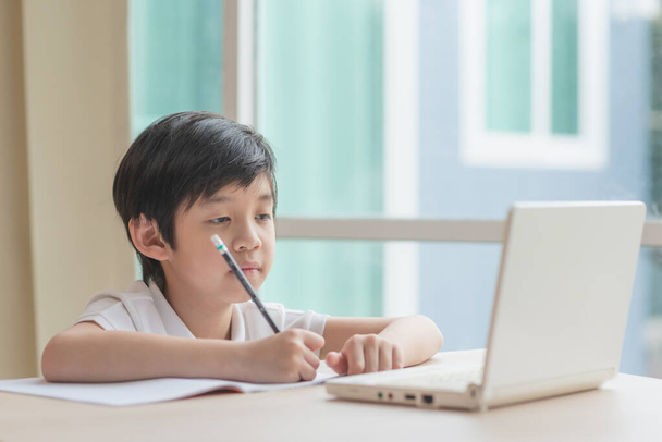 Asian Child tired and bored of doing homework, kid stressed from learning - Photo, Image