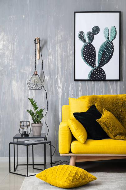 Stylish interior of room with yellow sofa and new lamps - Photo, Image