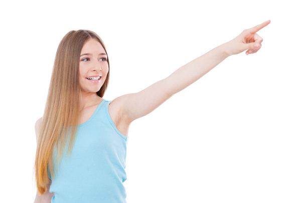 Teenage girl pointing away - Photo, image