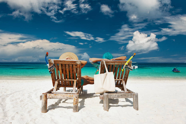 Couple in green relax on a tropical beach at Maldives - Photo, Image