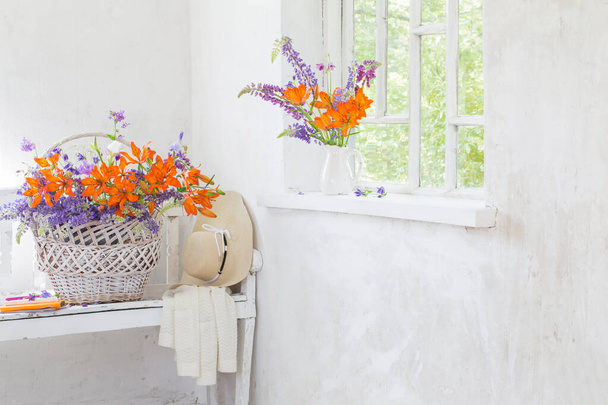 lilly and lupine flowers in vintage white interior - Фото, зображення