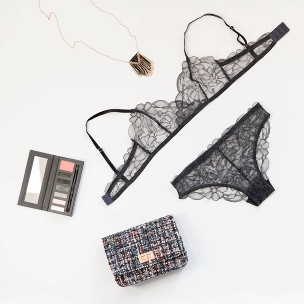 Shopping and fashion concept. Set of glamorous stylish sexy lace lingerie with cosmetic products, woman accessories on white background. Top view point, flat lay. - Photo, Image