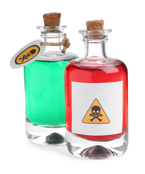 Glass bottles of poisons with warning signs on white background - Photo, image