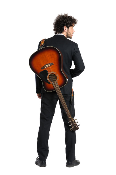 Young Man Carrying Guitar - Foto, afbeelding