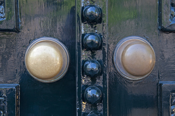 Door knobs of canal house where Otto Frank ran his business in Amsterdam - Photo, Image