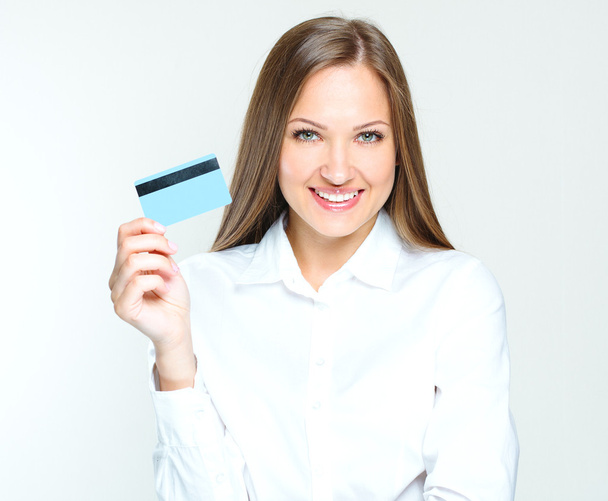 Business woman holding credit card - Fotoğraf, Görsel