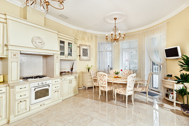 Classic style kitchen and dining room interior in beige pastoral colors - Фото, зображення