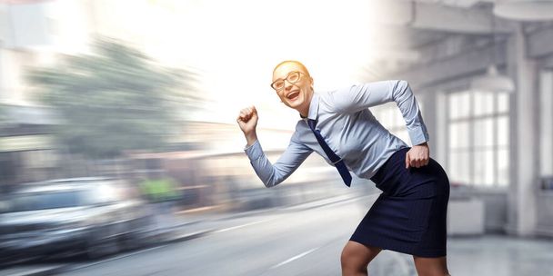 Portrait of business woman running - Photo, image
