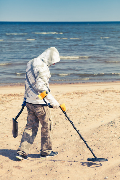man searching for a precious metal using a metal detector - Photo, Image