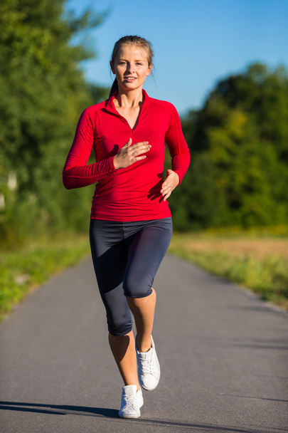 Woman running - Фото, изображение