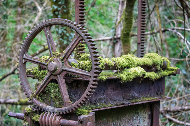 Close up of abandoned old iron sluice gate on the River Mells in Somerset, UK - Photo, Image
