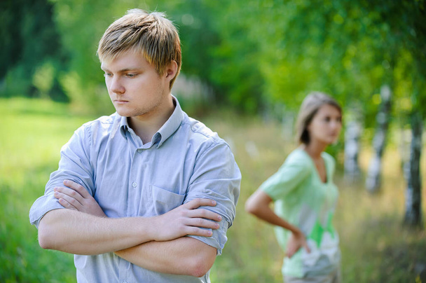 Young handsome thoughtful man with a young woman in a summer park. - Photo, Image