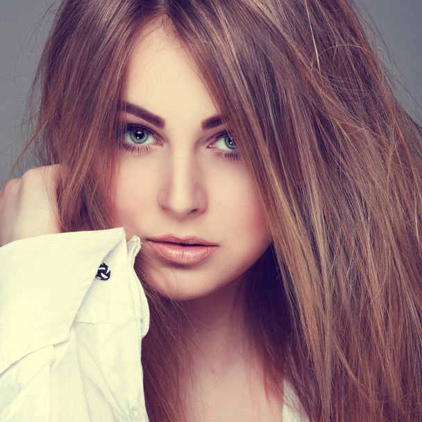 Beautiful  girl, isolated on a light - grey  background, emotions, cosmetics - Fotografie, Obrázek