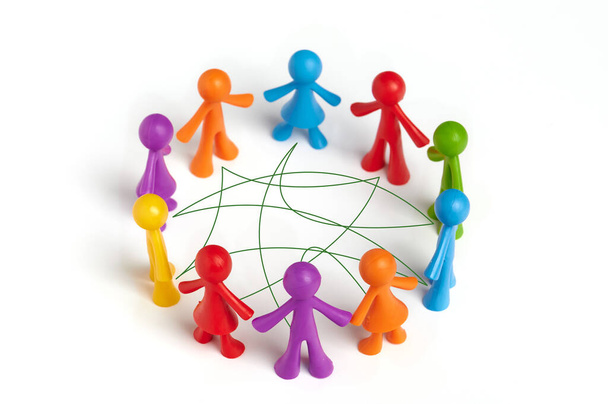 Group of toy people connected by lines isolated on white background. The concept of collaborative problem solving, diplomacy, social connection, teamwork, - Photo, Image