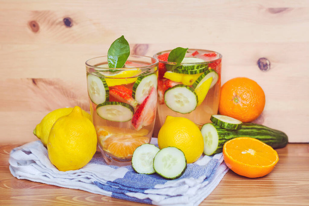 Infused Water with Fresh Organic Lemon, Cucumber, Strawberry and Tangerines - Photo, image