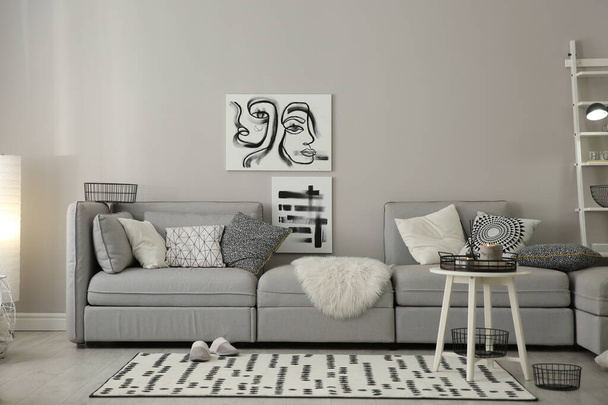 Cozy living room interior with big grey sofa - Valokuva, kuva