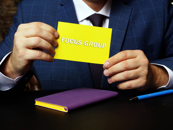  Financial concept meaning FOCUS GROUP with sign on the piece of paper. Conceptual photo showing a group interview involving a small number of demographically similar people - Photo, Image