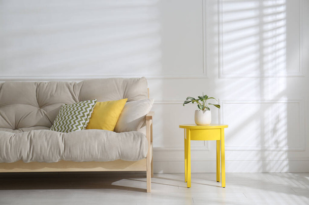 Stylish beige sofa in living room interior - Foto, Imagem