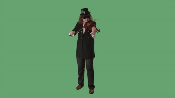 A violinist in a black suit, hat and original glasses plays the violin masterly. The man touches the strings with a bow to create a melody. Green screen chroma key. Slow motion. - Materiał filmowy, wideo