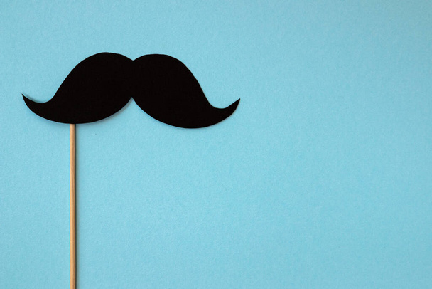 photo booth props black mustache on blue background, happy father day - Photo, Image
