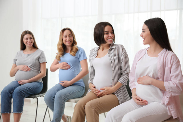 Group of pregnant women at courses for expectant mothers indoors - Fotografie, Obrázek