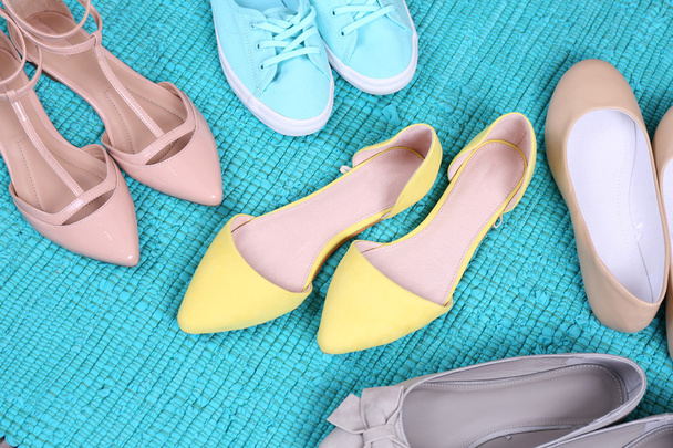 Female fashion shoes on blue carpet  - Zdjęcie, obraz