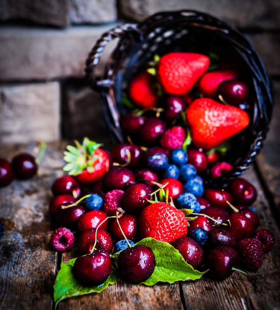 Berries mix on rustic background - Фото, изображение