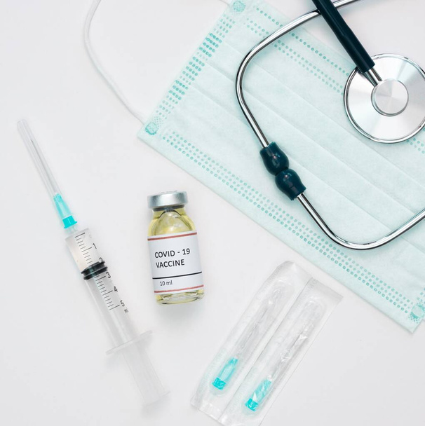flat lay vaccine with syringe stethoscope. Resolution and high quality beautiful photo - Photo, Image
