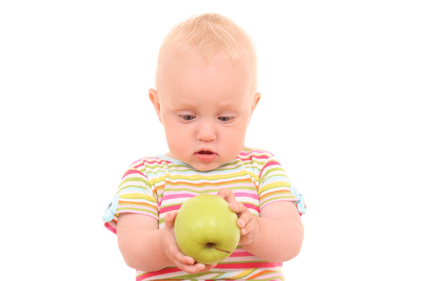 lovely 10 months baby girl with green apple isolated on white - Foto, Imagen