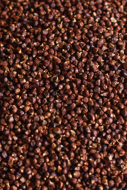 Black pepper grains, peppercorns seeds on a background close up macro - Photo, image