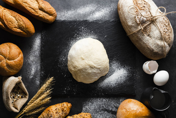flat lay dough bread black background. Resolution and high quality beautiful photo - Photo, Image