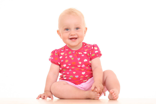 白で隔離され素敵な 10 ヶ月の赤ちゃん女の子 - 写真・画像