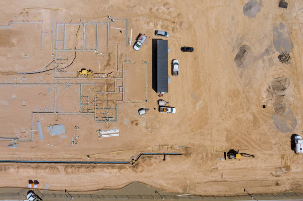 Aerial view construction work in the laying pipes in the foundation for new residential complex buildings - Photo, Image