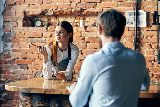 female waiter next to customer service lifestyle work - Фото, зображення