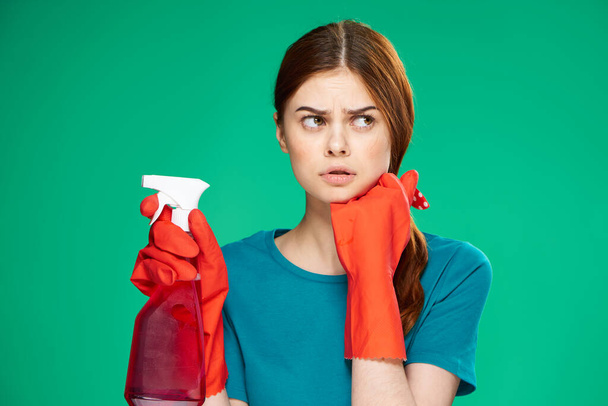 emotional woman detergent service housework green background - Fotó, kép