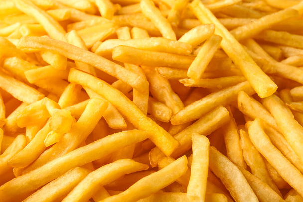 tas de frites savoureuses comme fond - Photo, image