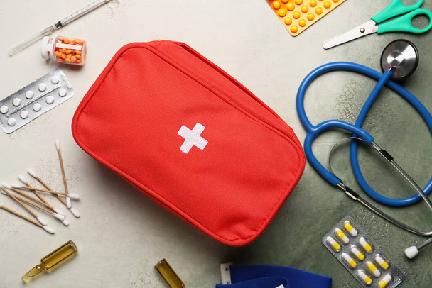 First aid kit on light background - Foto, Imagen