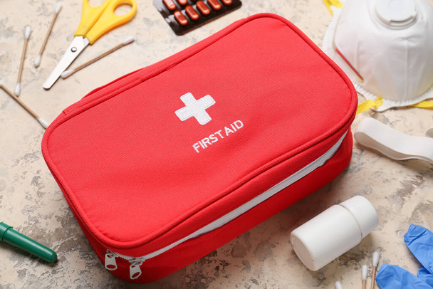 First aid kit on grunge background - Fotoğraf, Görsel