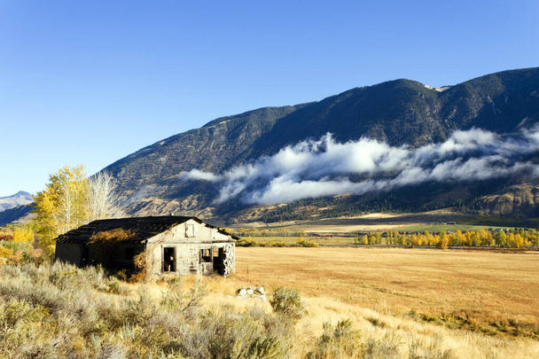 Autumn landscape of fall colors and an abandoned house in the Similkameen Valley near Cawston, British Columbia, Canada  - Photo, Image