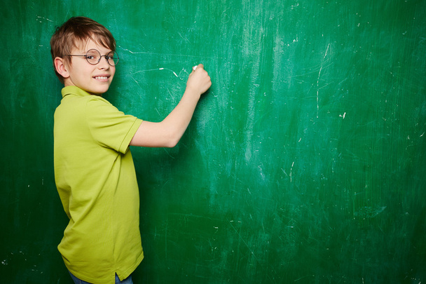 Schoolboy by blackboard - Photo, Image